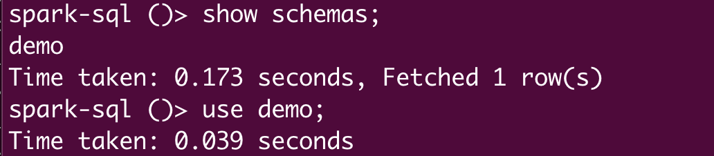 Terminal output showing Spark SQL commands to display schemas, listing only &#x27;demo&#x27; schema with execution time, followed by a command to use the &#x27;demo&#x27; schema.